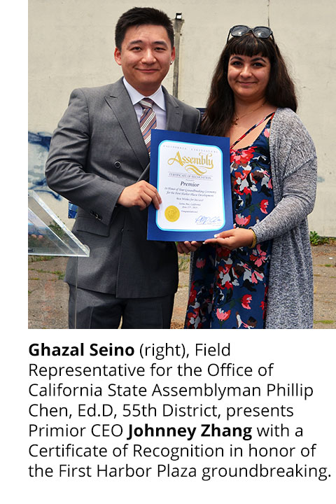 Ghazal Seino (right), Field Representative for the Office of California State Assemblyman Phillip Chen, Ed.D, 55th District, presents Primior CEO Johnney Zhang with a Certificate of Recognition in honor of the First Harbor Plaza groundbreaking.